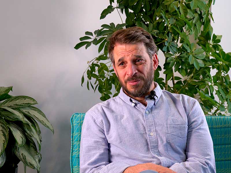 Andy speaks during an interview