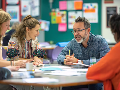 Administrators meeting around a table