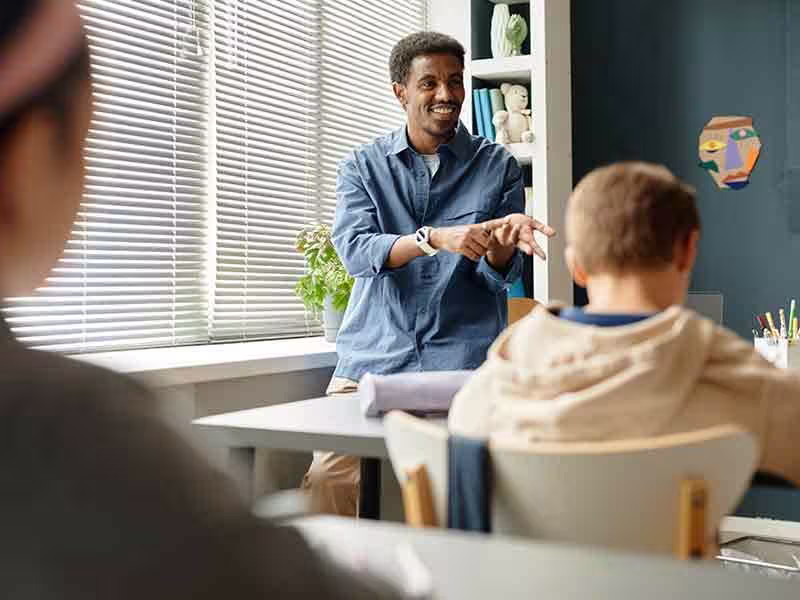 Smiling teacher engaging with class