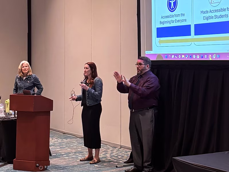 NCADEMI presenters at ATIA with a sign language interpreter.